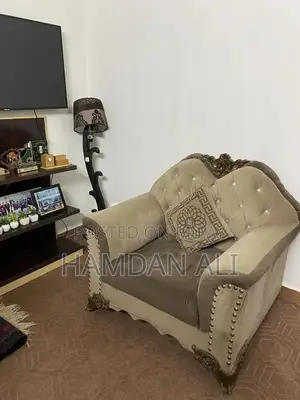 Elegant Velvet Sofa with Carved Wood Frame and Shiny Buttons