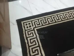 Living Room Set: Sofa, Side Table, and Area Rug Combination