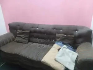 Living Room Set: Sofa, Side Table, and Area Rug Combination