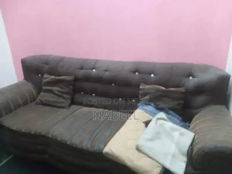 Living Room Set: Sofa, Side Table, and Area Rug Combination