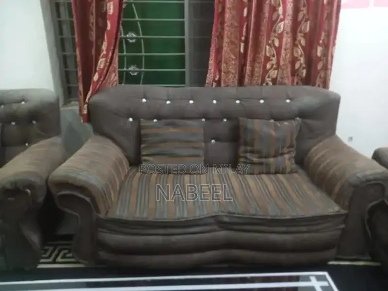 Living Room Set: Sofa, Side Table, and Area Rug Combination