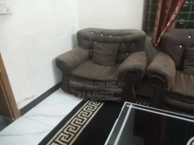 Living Room Set: Sofa, Side Table, and Area Rug Combination