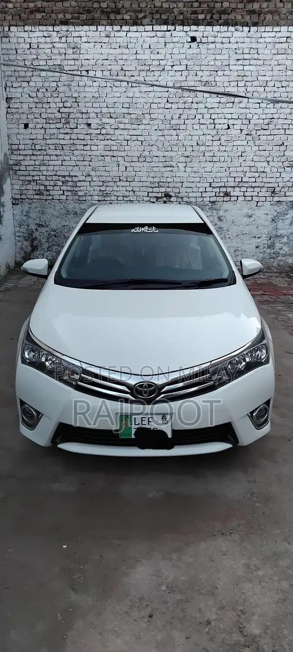 Toyota Corolla Gli 16 White Sedan with Manual Transmission