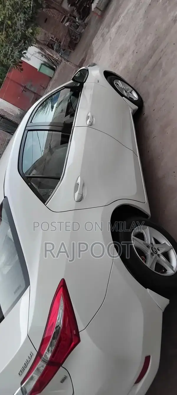 Toyota Corolla Gli 16 White Sedan with Manual Transmission