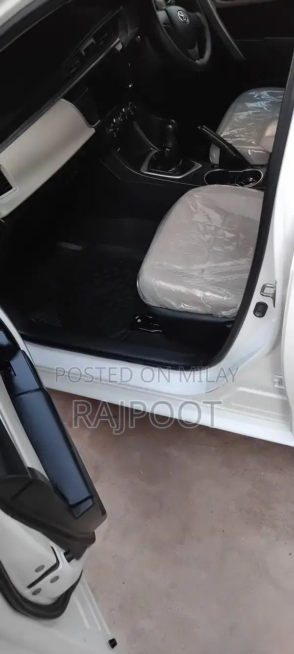 Toyota Corolla Gli 16 White Sedan with Manual Transmission