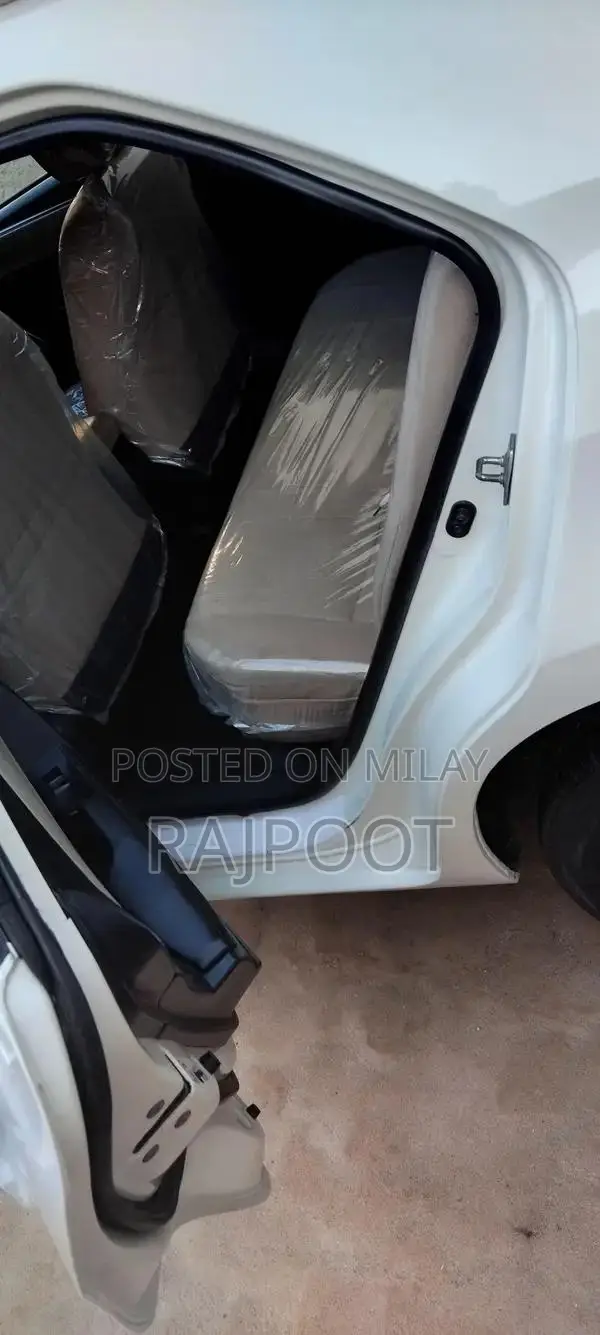 Toyota Corolla Gli 16 White Sedan with Manual Transmission