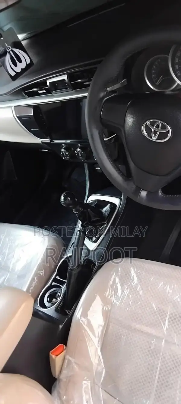 Toyota Corolla Gli 16 White Sedan with Manual Transmission