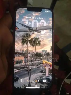 Photo - Red Color Smartphone with Perfect Battery Health