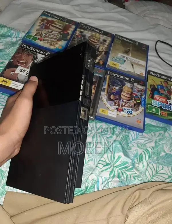 PlayStation 2 Slim Console with Games and Accessories