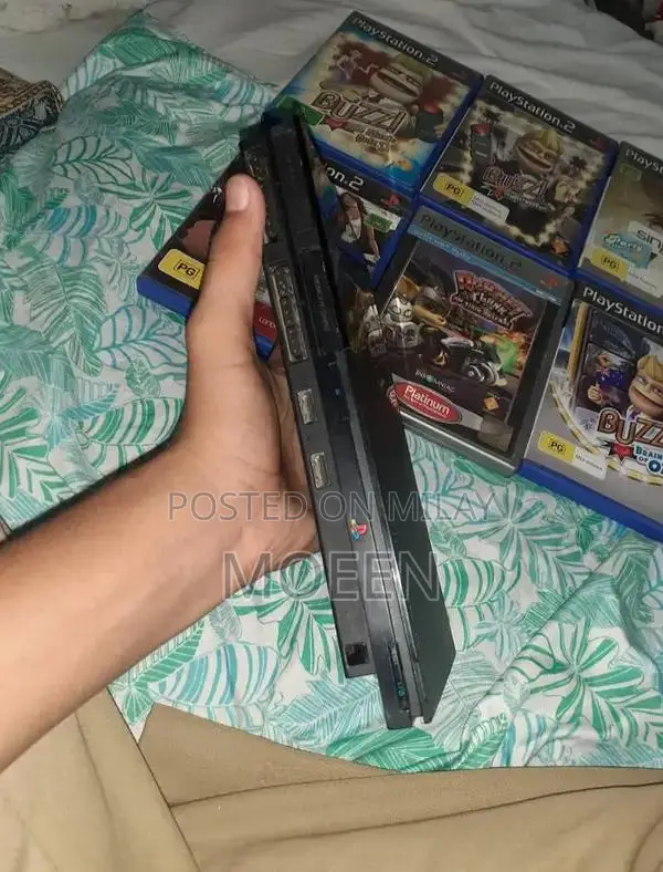 PlayStation 2 Slim Console with Games and Accessories