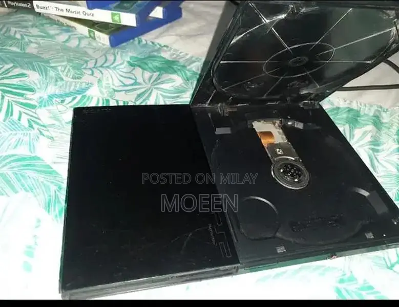 PlayStation 2 Slim Console with Games and Accessories