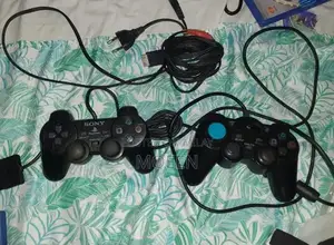 PlayStation 2 Slim Console with Games and Accessories