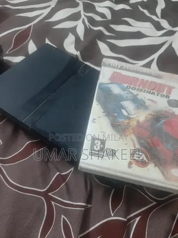 PlayStation 2 Console with Game, Controller, and Accessories