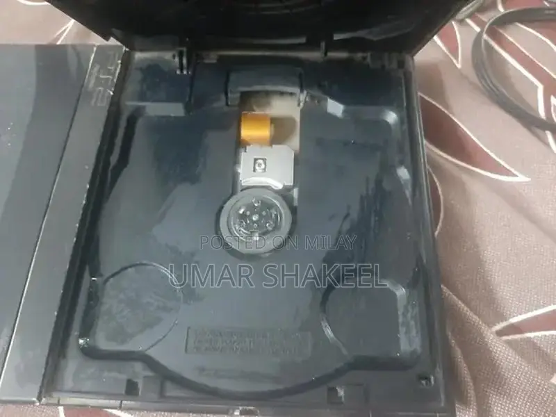 PlayStation 2 Console with Game, Controller, and Accessories