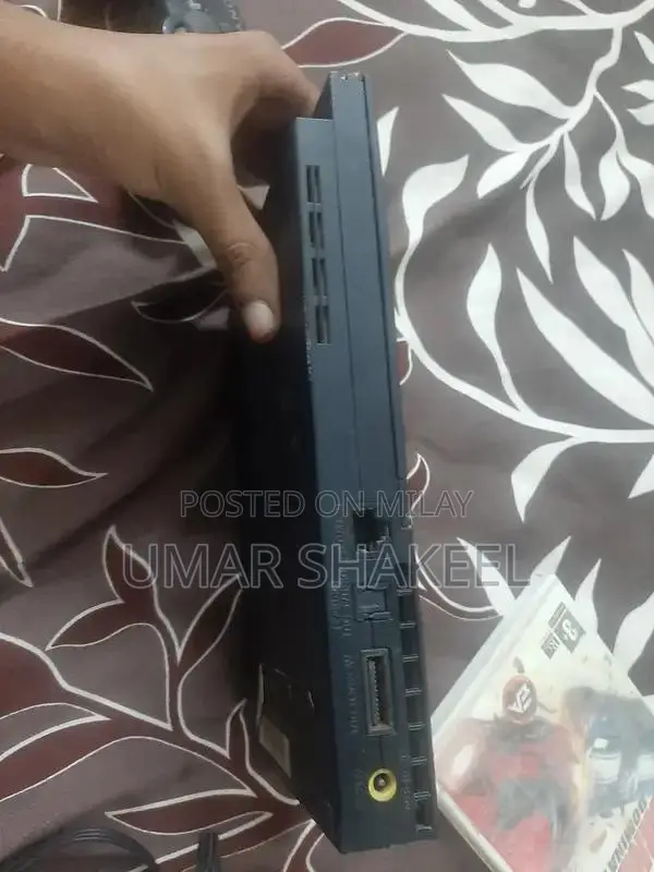 PlayStation 2 Console with Game, Controller, and Accessories