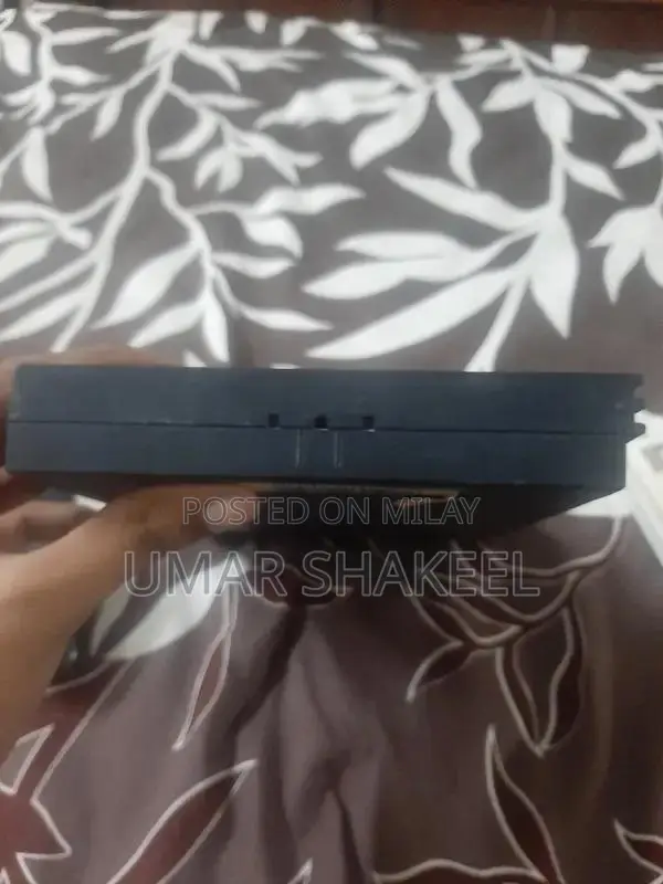 PlayStation 2 Console with Game, Controller, and Accessories