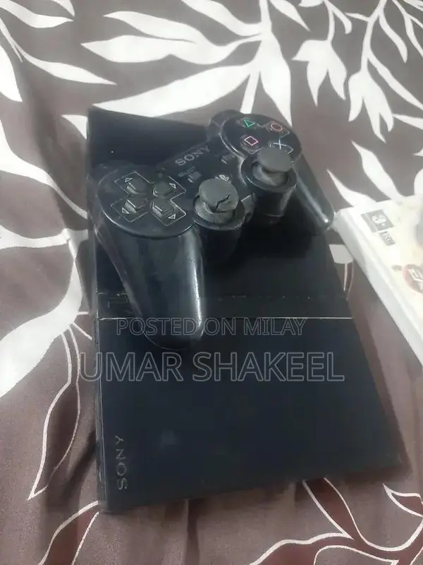 PlayStation 2 Console with Game, Controller, and Accessories