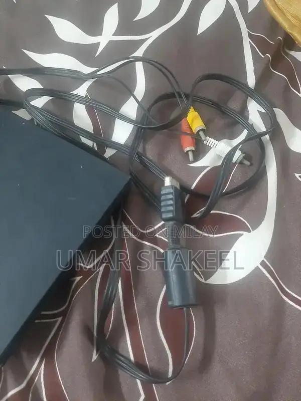 PlayStation 2 Console with Game, Controller, and Accessories