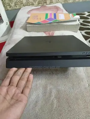 Photo - PS4 Slim Jailbroken Gaming Console with Two Controllers