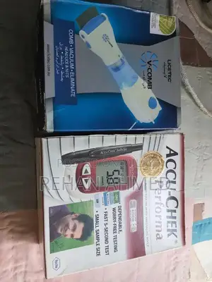 Photo - V-Comb Anti-Lice Vacuum Machine and Accu-Check Glucose Meter