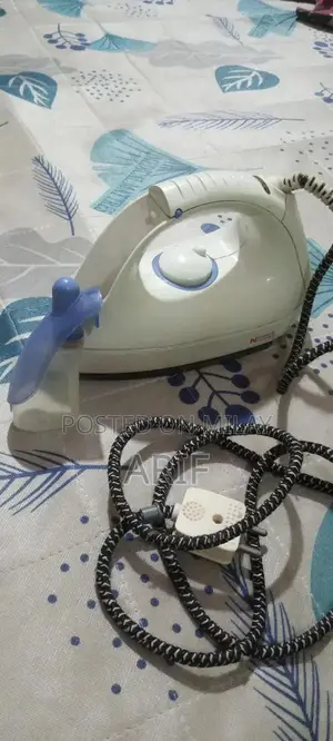 Photo - Compact Steam Iron with Smooth Gliding Surface