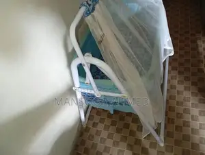 Photo - Baby Swing for Infant Play and Comfort