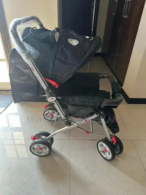 Photo - Baby Stroller with Adjustable Shade and Accessory Pouch