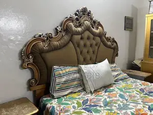 Photo - Luxury King Size Bed with Carved Wooden Headboard and Side Tables