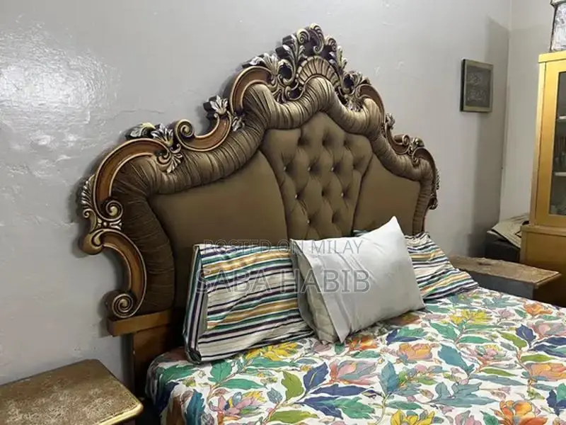 Luxury King Size Bed with Carved Wooden Headboard and Side Tables