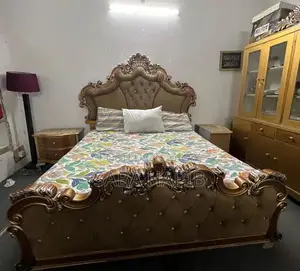 Luxury King Size Bed with Carved Wooden Headboard and Side Tables