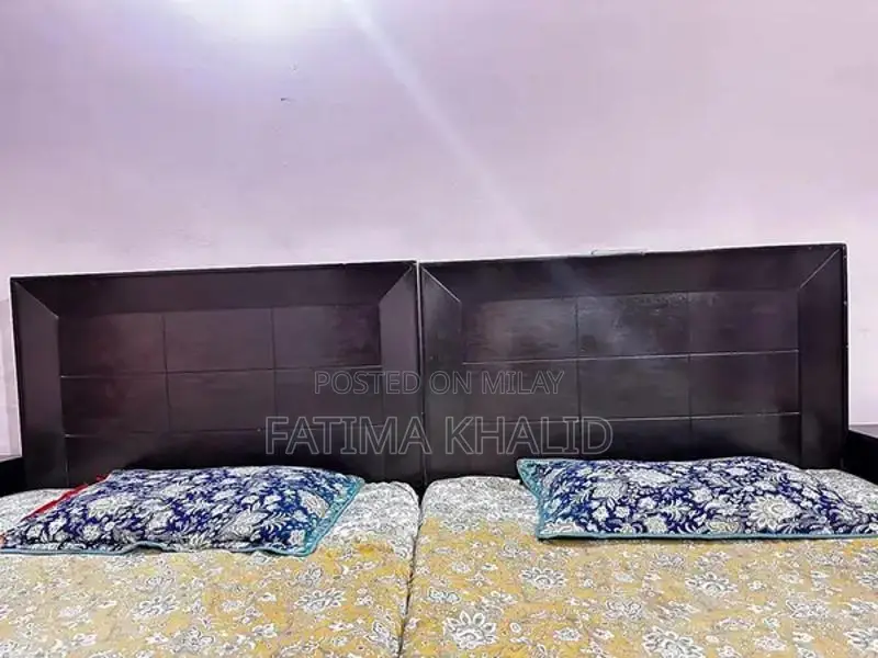 Two Single Beds with Matching Side Tables