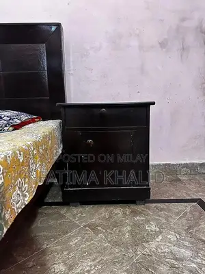 Two Single Beds with Matching Side Tables