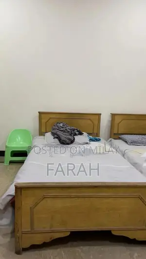 Photo - 2 Single Wooden Beds