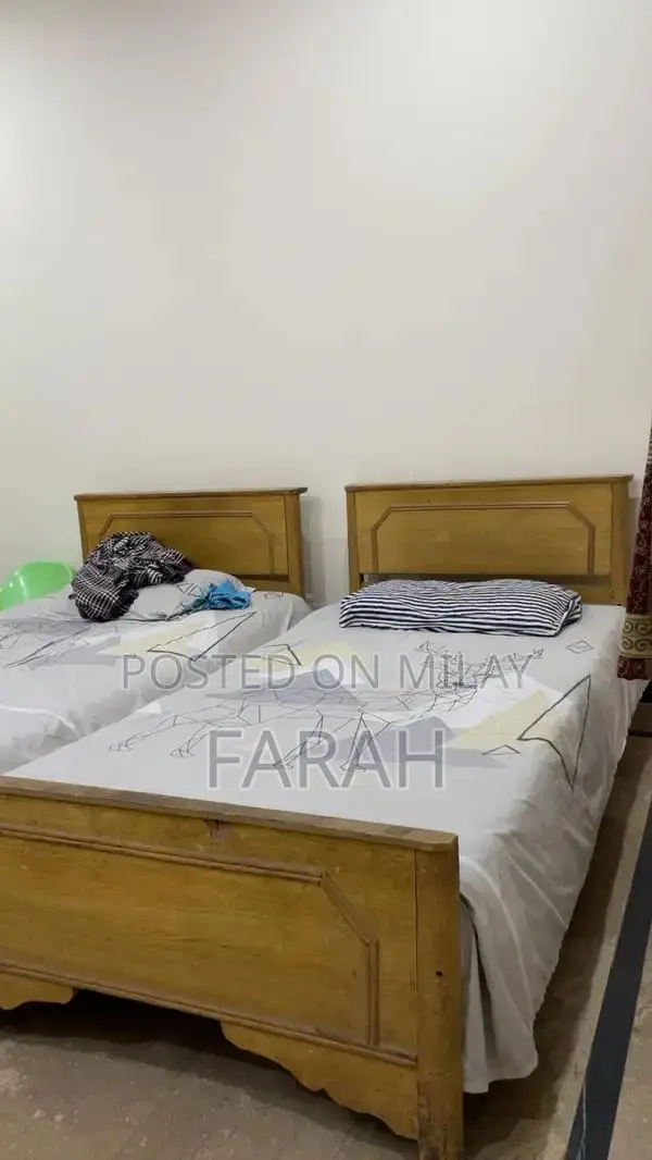 2 Single Wooden Beds