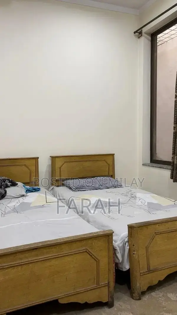 2 Single Wooden Beds