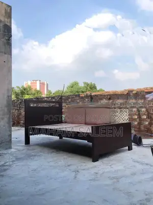 Photo - 2 single wooden beds