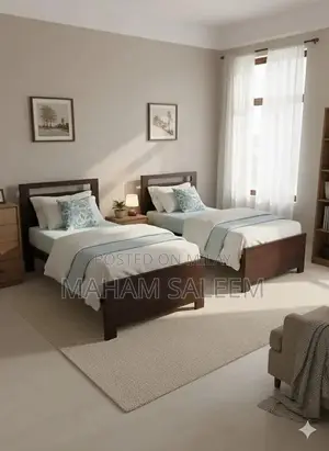 2 single wooden beds