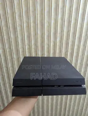 Photo - PlayStation 4 Fat 500GB Console with Controller and Game