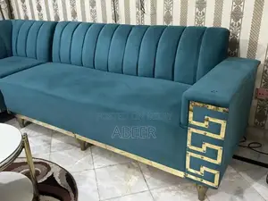 Luxury L-Shaped Sofa Set with Metallic Carving + Table & Puffies