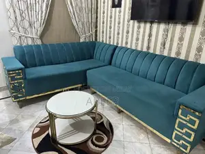 Luxury L-Shaped Sofa Set with Metallic Carving + Table & Puffies