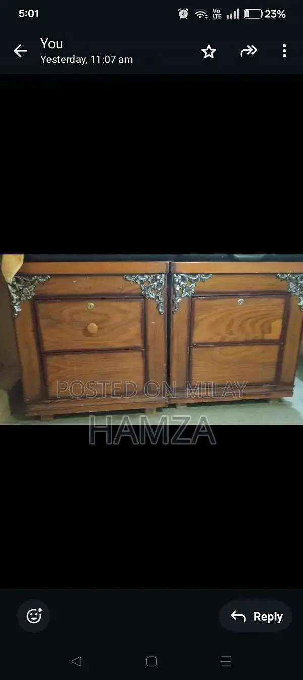 wooden bed with side table