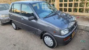 Photo - Daihatsu Coure 2005 Metallic Silver Compact Hatchback