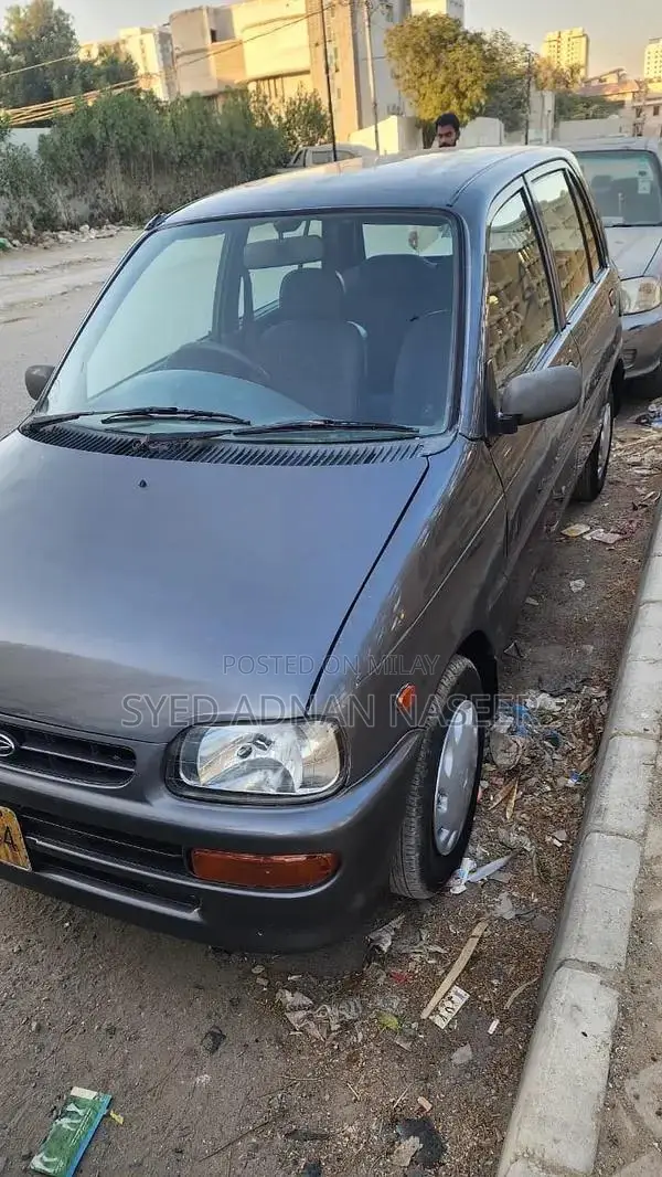 Daihatsu Coure 2005 Metallic Silver Compact Hatchback