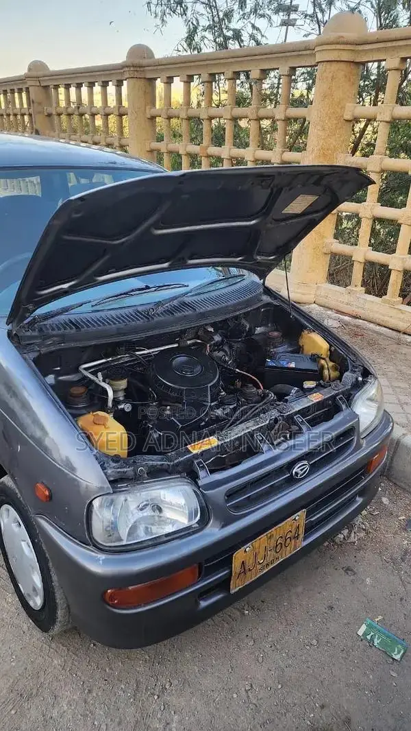 Daihatsu Coure 2005 Metallic Silver Compact Hatchback
