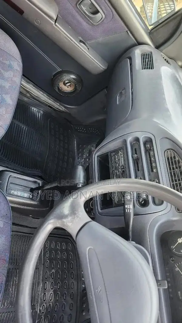 Daihatsu Coure 2005 Metallic Silver Compact Hatchback