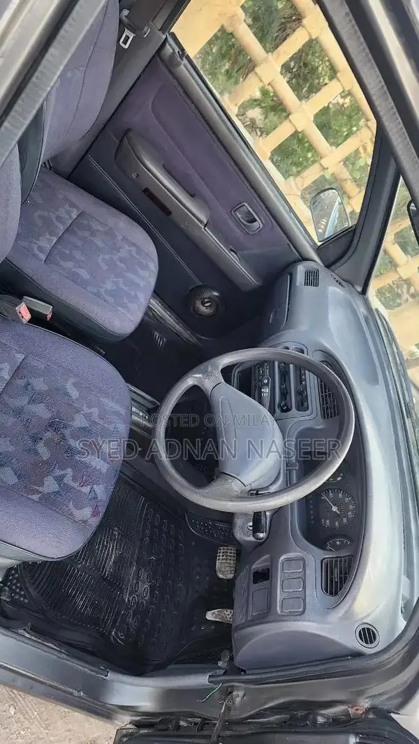 Daihatsu Coure 2005 Metallic Silver Compact Hatchback