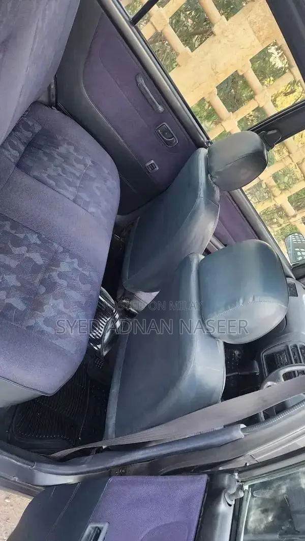 Daihatsu Coure 2005 Metallic Silver Compact Hatchback