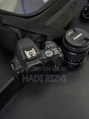 Photo - Canon EOS 200D DSLR Camera with 18-55mm Zoom Lens