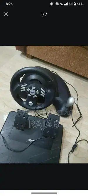 Photo - Gaming Steering Wheel with Brake and Accelerator Controls