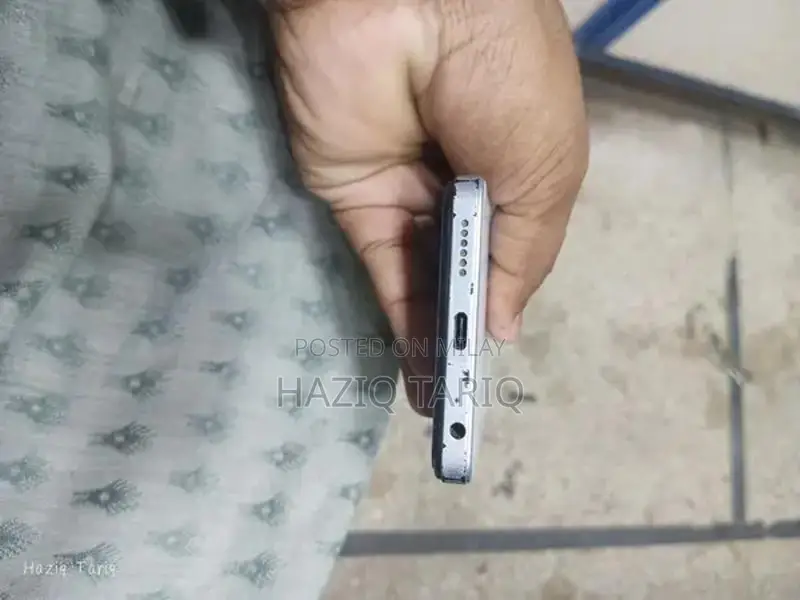 Budget-Friendly Smartphone with Glass Panel and Ample Storage